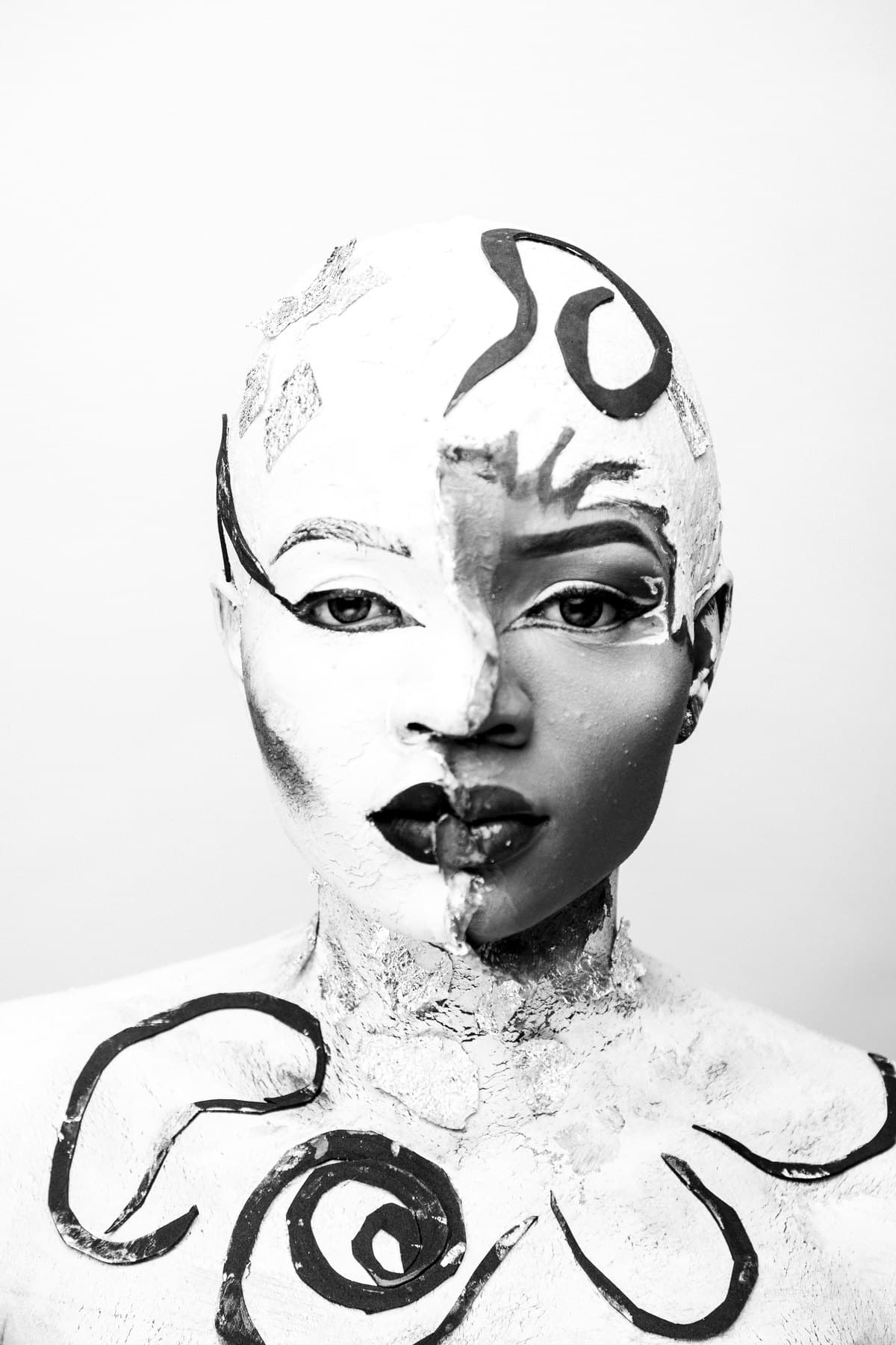 LUCH painted-mask portrait, split face frontal, black and white