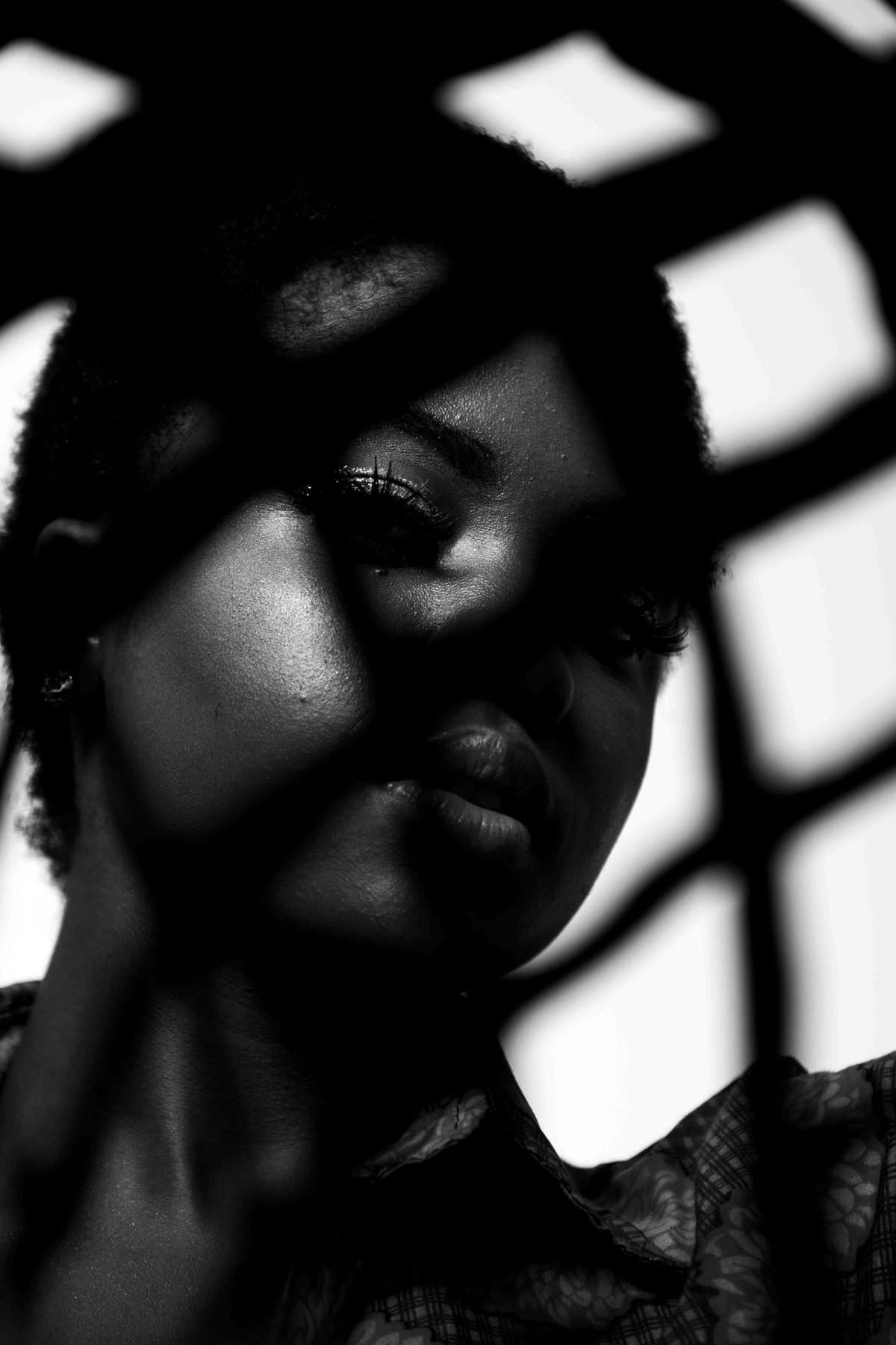 Patterned light carving skin into geometry, black and white